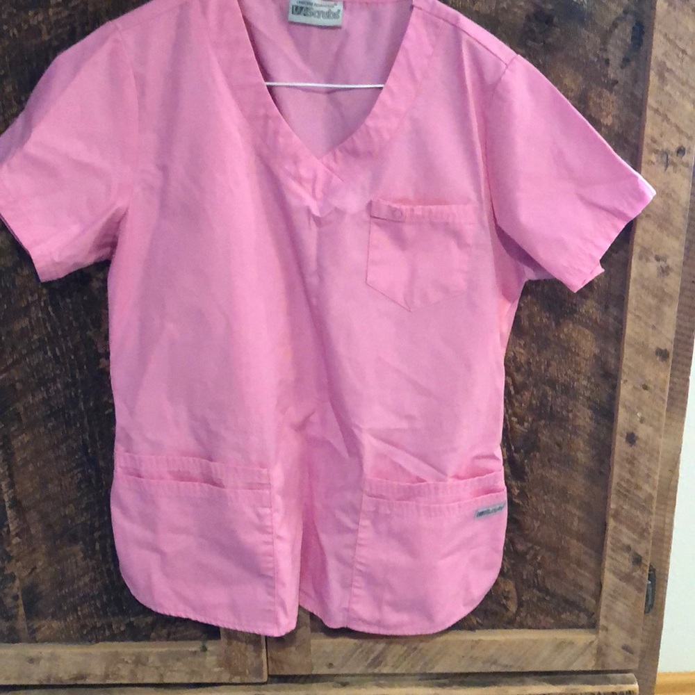 UA women’s pink scrub top.